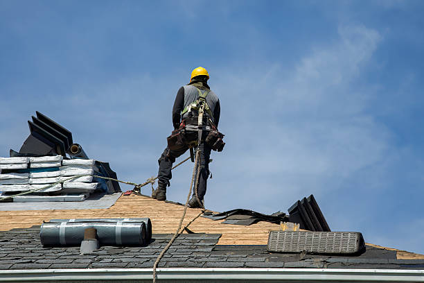 Professional Roof Replacement technician working in Carlton, OR